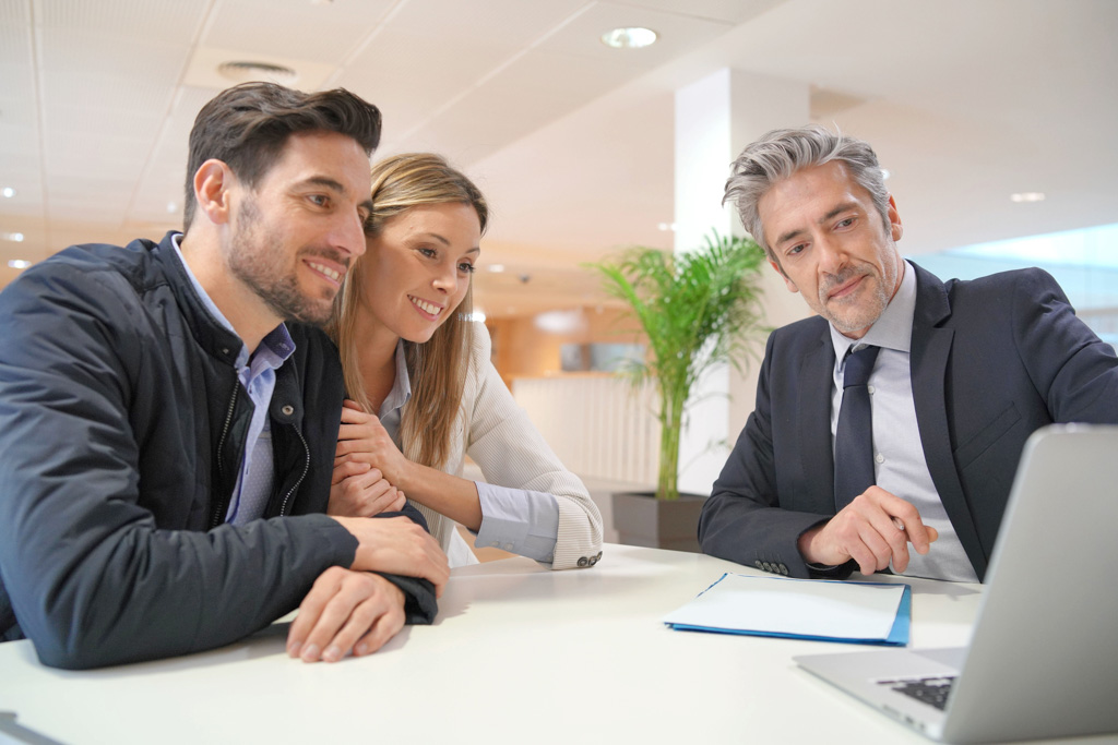 Married business partners meeting with a small business development center consultant